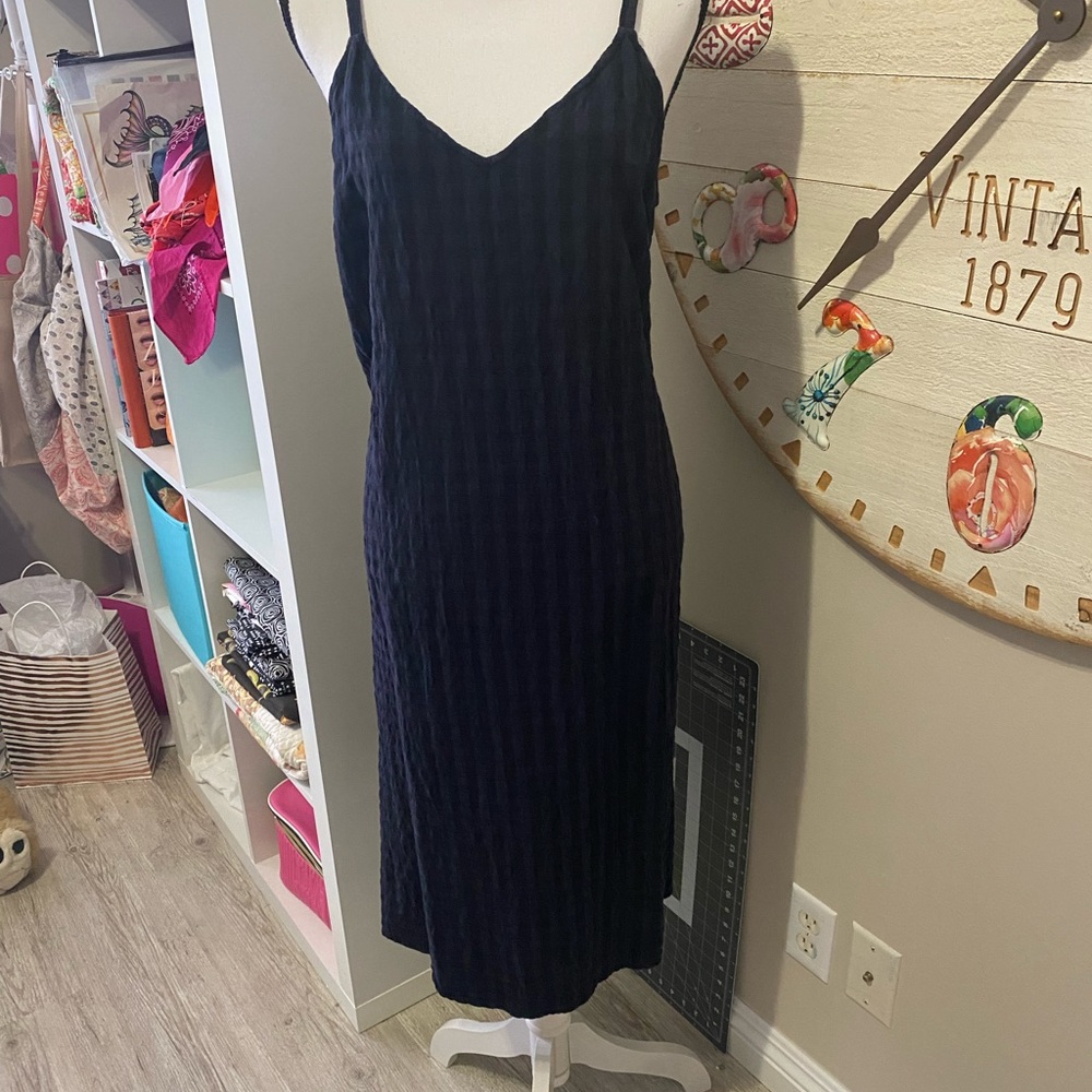 Black strapped summer dress or coverup.